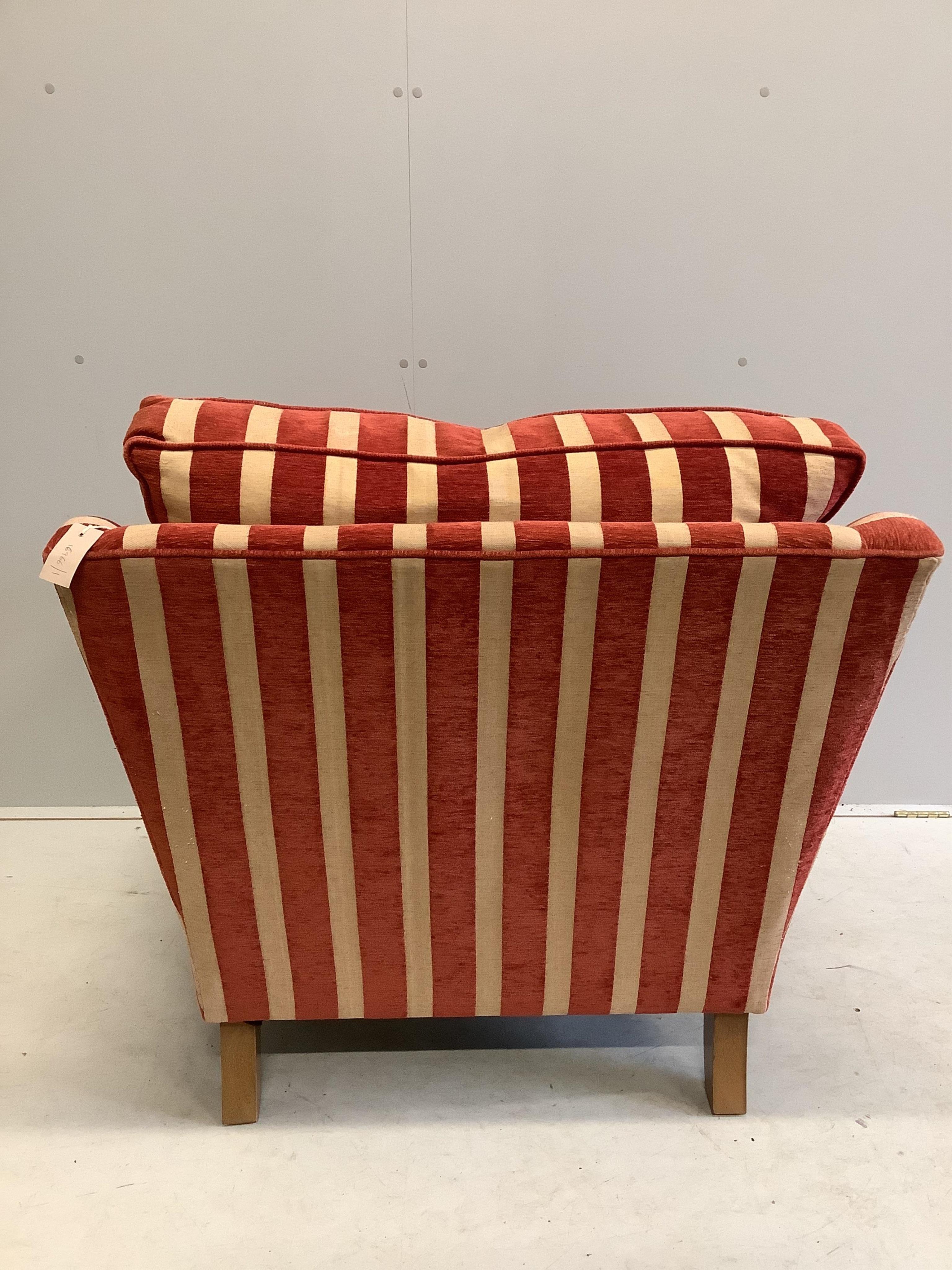 A Contemporary club armchair upholstered in Colefax & Fowler striped fabric, width 88cm, depth 89cm, height 93cm. Condition - fair